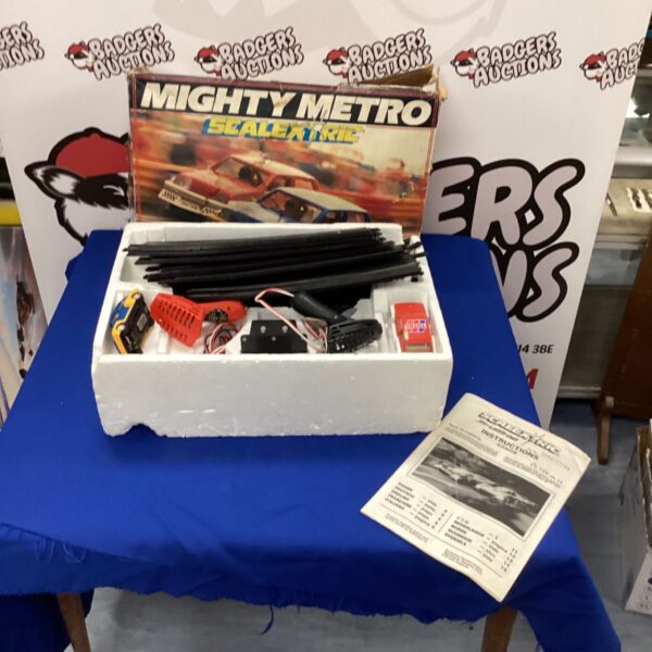 Vintage Scalextric Metro track set with cars and controllers.