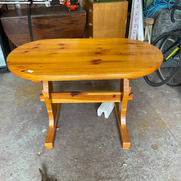 Vintage Scandinavian oval wood table with simple legs.