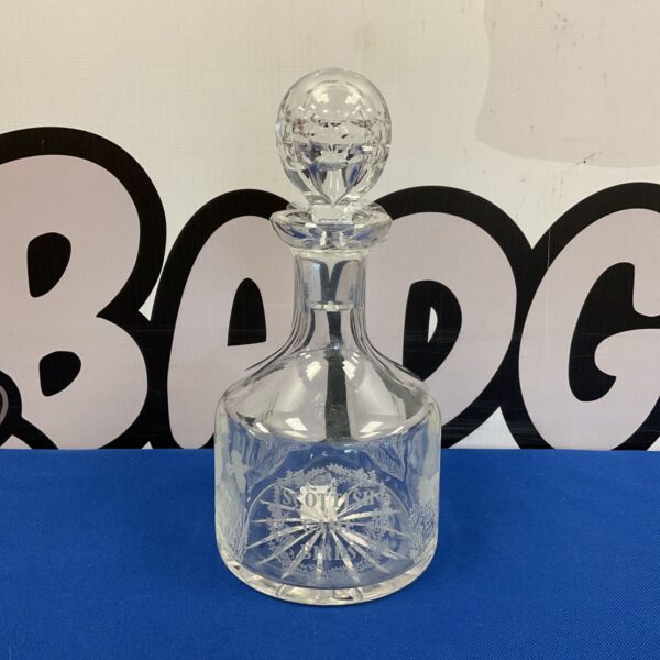 Intricate Scottish game bird engraved crystal decanter for collectors.