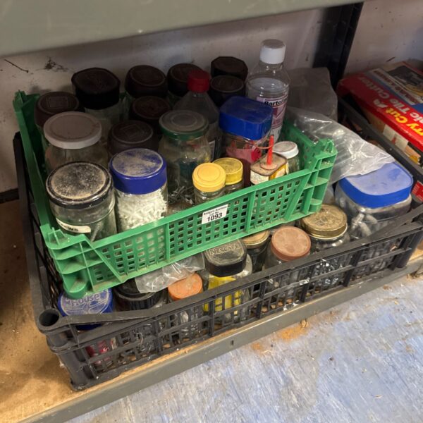 Assorted screws, nuts, and bolts in a plastic tray.