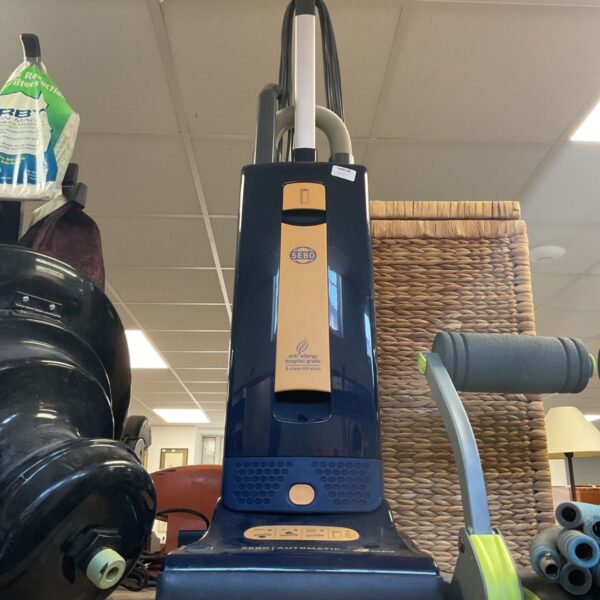 Blue Sebo Automatic X4 upright vacuum cleaner for home floor cleaning.