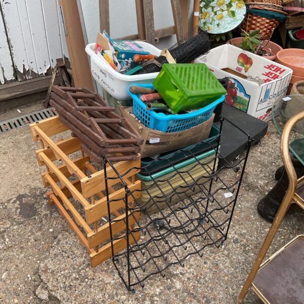 A collection of plastic seed trays and garden supplies.