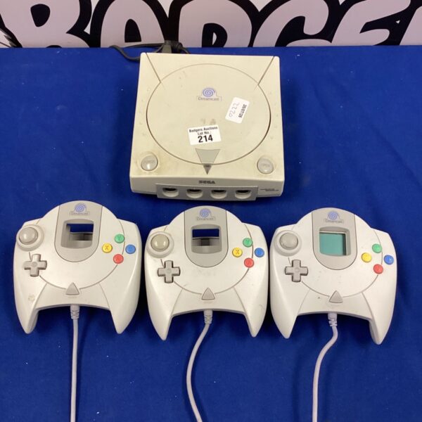 Sega Dreamcast console with controllers and VMU for retro gaming.