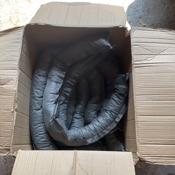 Box containing used automotive shock absorbers for vehicle suspension.