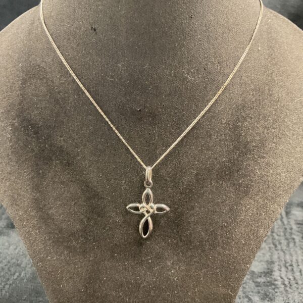 Silver Celtic cross pendant on a silver chain.