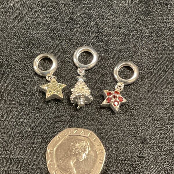 Close-up of a silver star charm pendant.