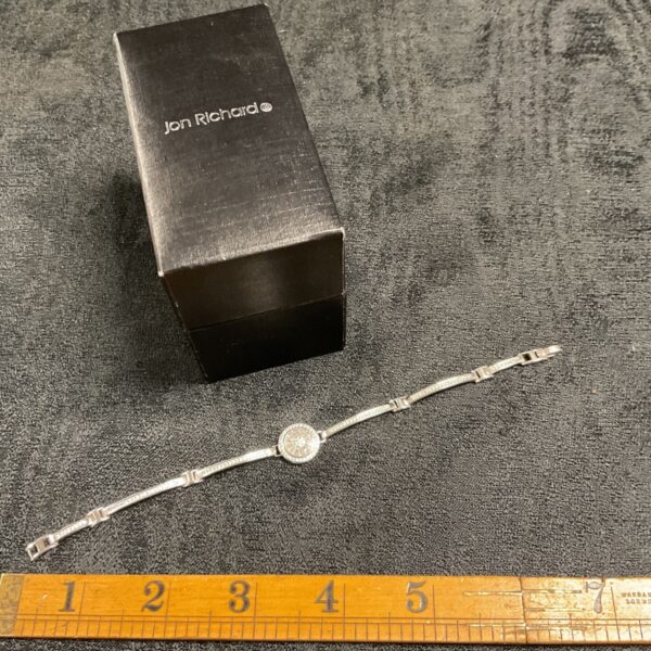 Silver cubic zirconia bracelet with white stones and a spring clasp.