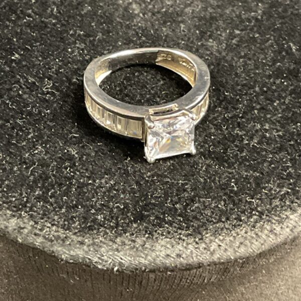 Silver ring with baguette cubic zirconia stones, UK size J.
