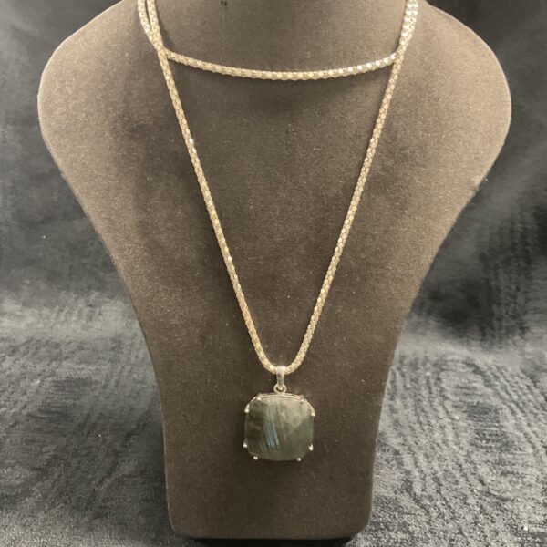 Silver necklace with a captivating labradorite pendant stone.