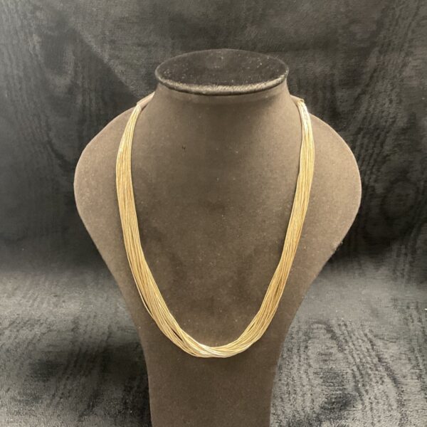 Elegant silver multi strand necklace, a stylish fashion accessory.