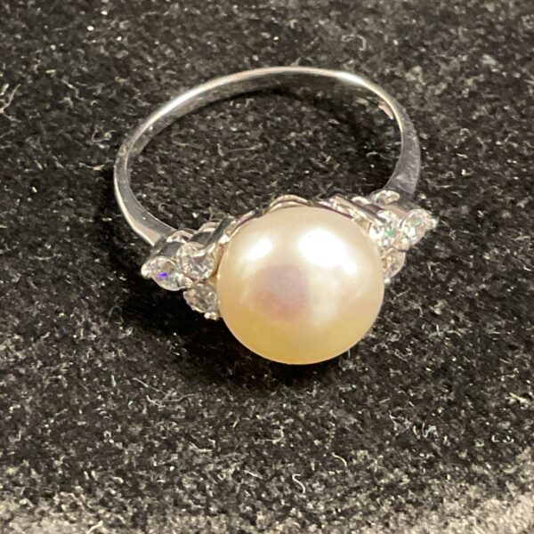 Silver ring with freshwater pearl and zirconia stones.