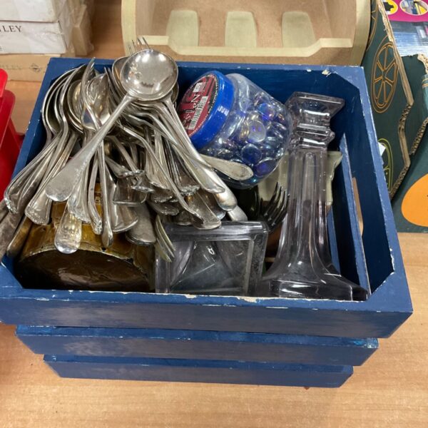 Mixed silver plate cutlery set in a box.