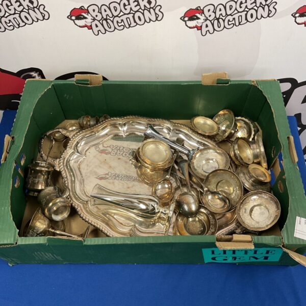 Vintage silver plate cutlery and serving trays displayed on a tray.