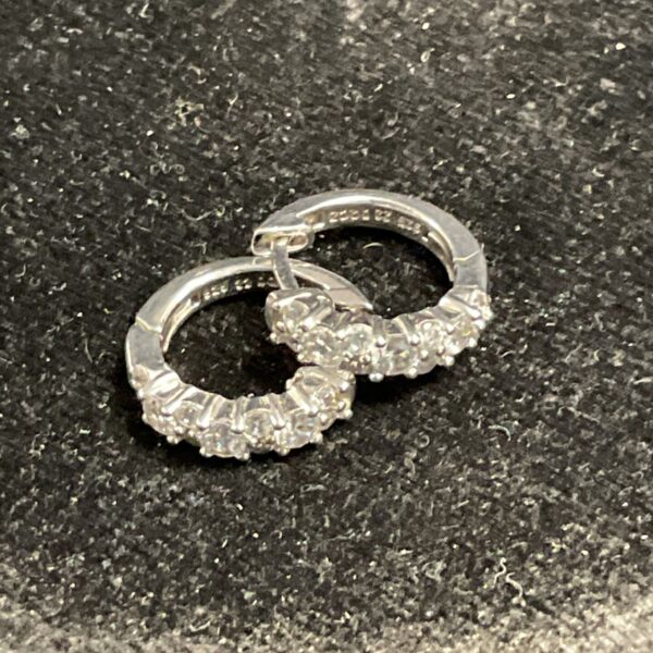 Silver stone set earrings, classic stud design with white stones.