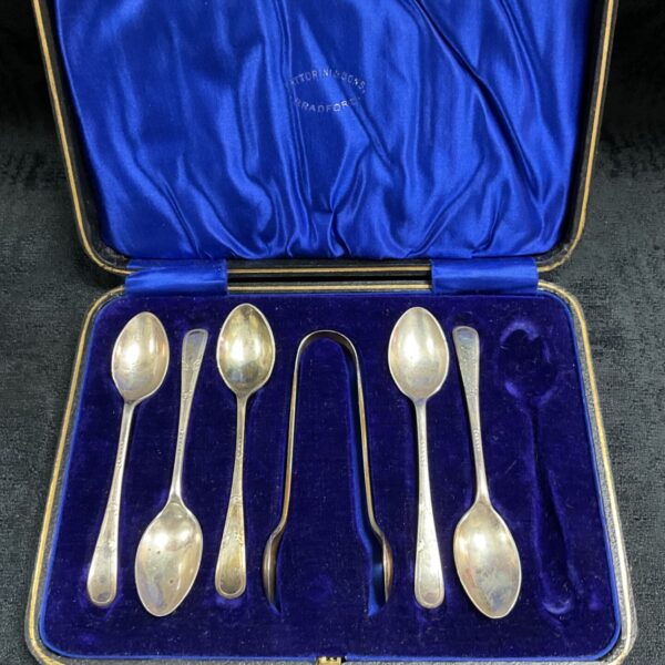 Hallmarked sterling silver teaspoon and tong set in velvet case.