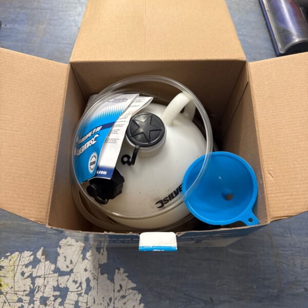 Silverline oil extractor pump inside open cardboard box.