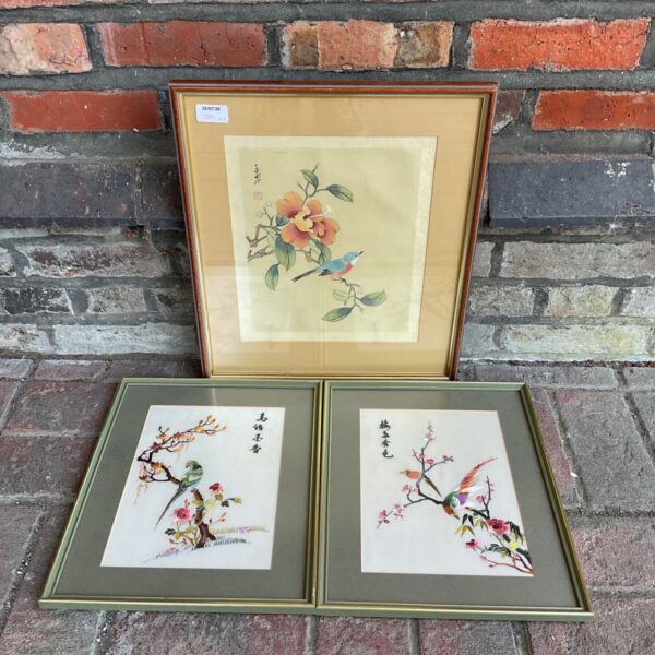 Vintage oriental watercolour and embroidery of songbirds in blossom.