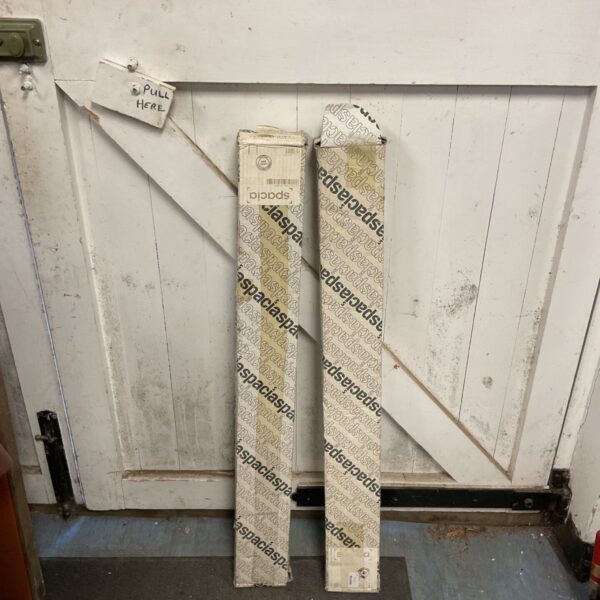 Two boxes of Spacia wood flooring boards measuring 915x102mm.