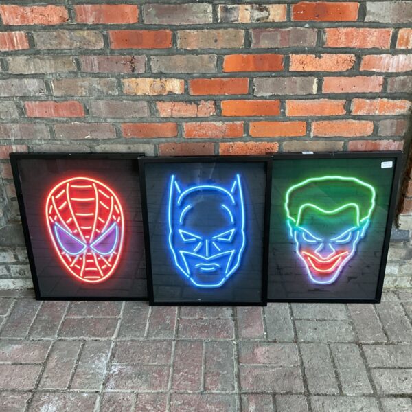 Vibrant neon Spider-Man print in a black frame.