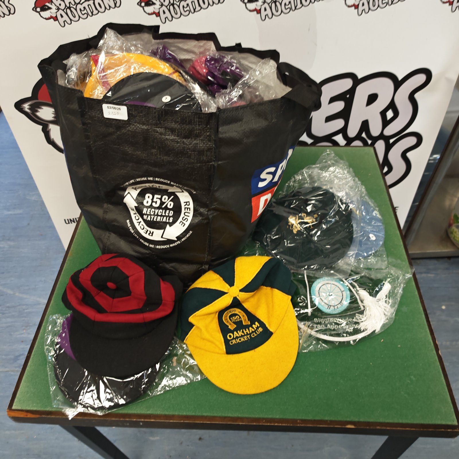 Lot of unused sporting caps with various team branding.