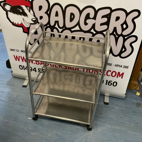 Stainless steel serving trolley with three tiers.