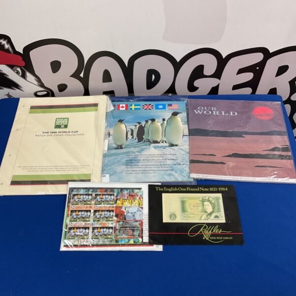 Stamp and banknote collection featuring 2006 World Cup stamps and English currency.
