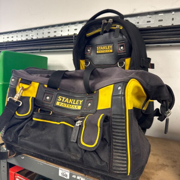 Close-up of a used Stanley Fatmax tool bag with multiple pockets.