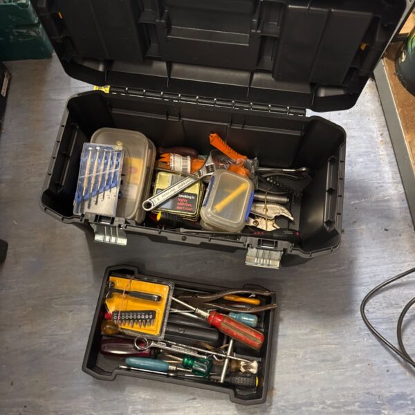 Open Stanley toolbox filled with various hand tools for DIY projects.