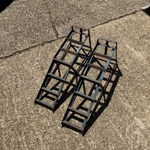 Heavy-duty steel car ramps for vehicle maintenance and repair.