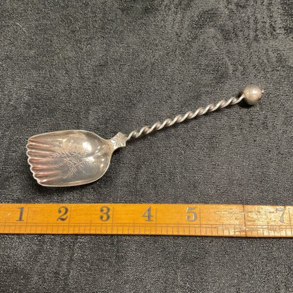 Antique sterling silver fruit spoon with twisted stem.