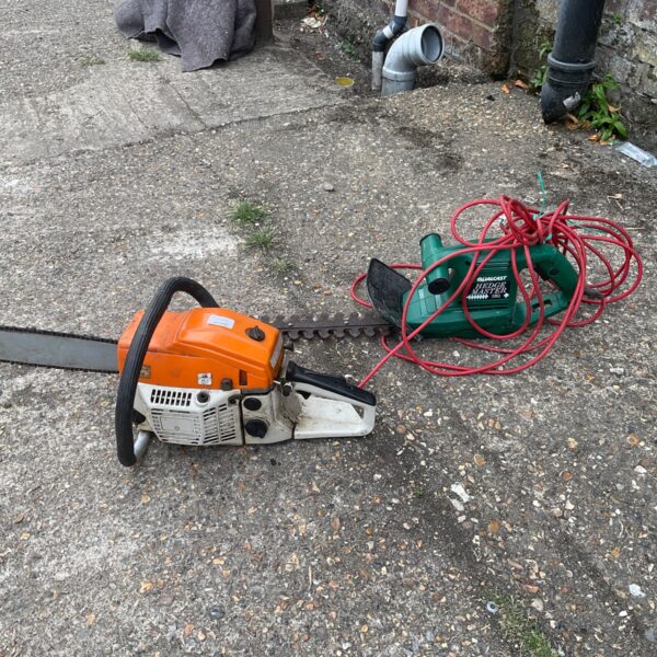 Stihl chainsaw and Qualcast hedge trimmer lot for garden maintenance.