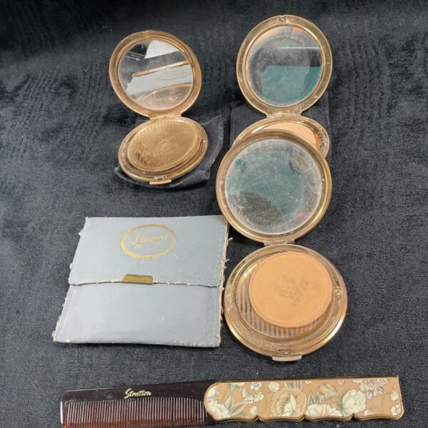 Vintage Stratton compacts and folding comb in a lot.