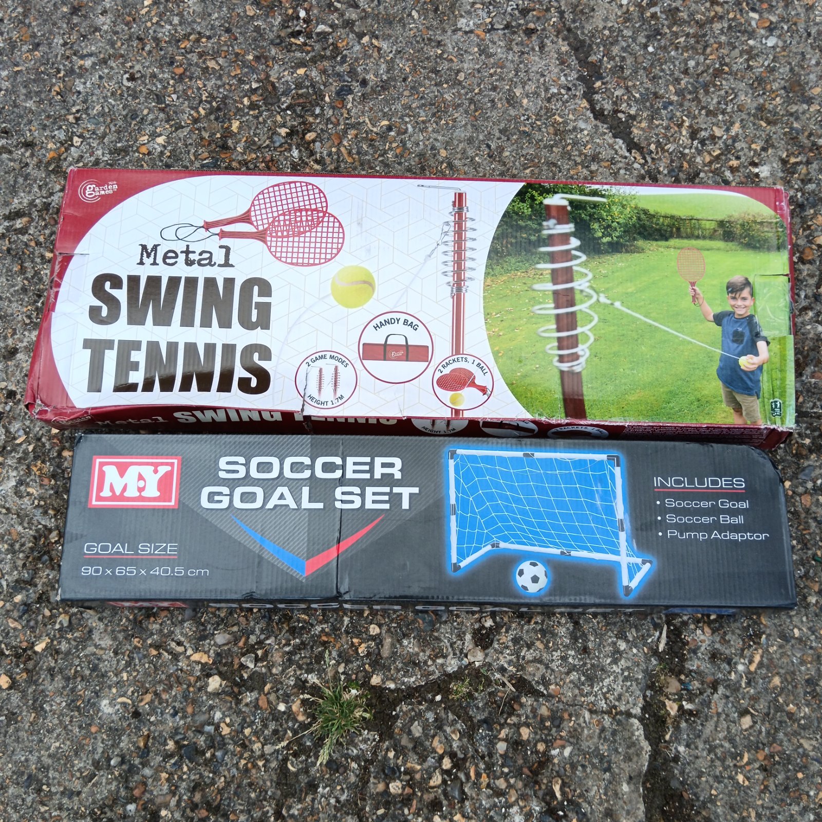 Swing tennis and football goal set in garden setting.