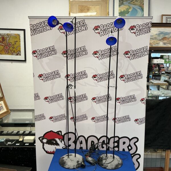 Vintage tall reading lamps with blue glass shades.