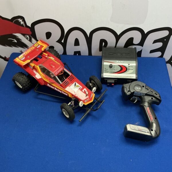 Vintage Tamiya Hornet RC car with remote and fast charger.