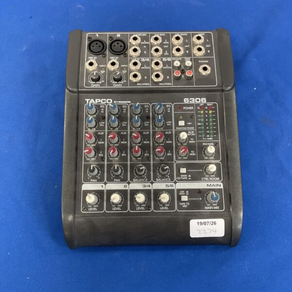 Tapco by Mackie 6306 mixer console with channels and controls visible.