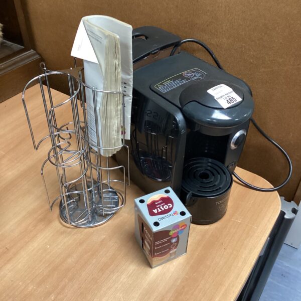 Black Tassimo coffee machine with pod holder for convenient coffee making.