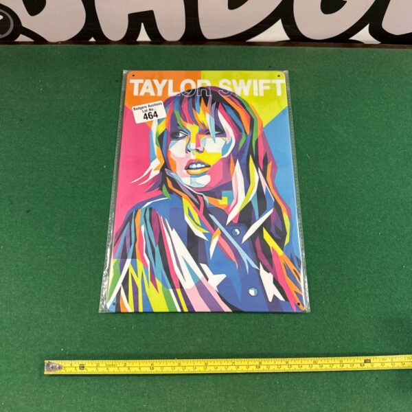 Vibrant Taylor Swift die bond sign, a colourful collectible prop.