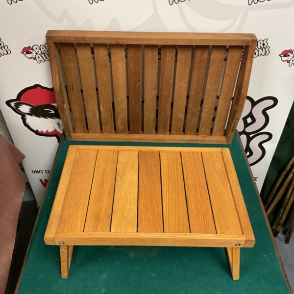 Vintage teak serving tray table with raised edges and tapered legs.
