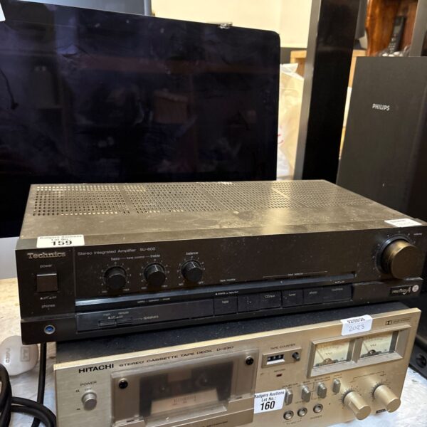 Vintage Technics SU-600 stereo amplifier with controls visible.