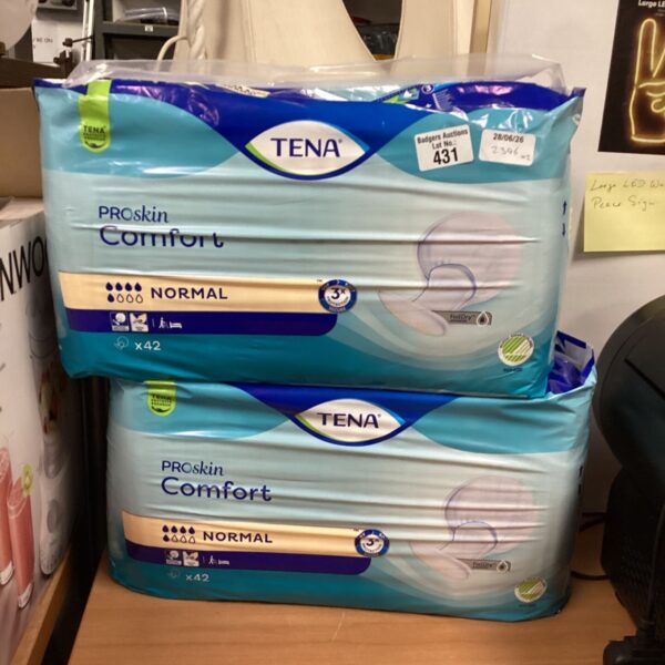 Two packs of Tena Pro Skin Comfort pads in original packaging.