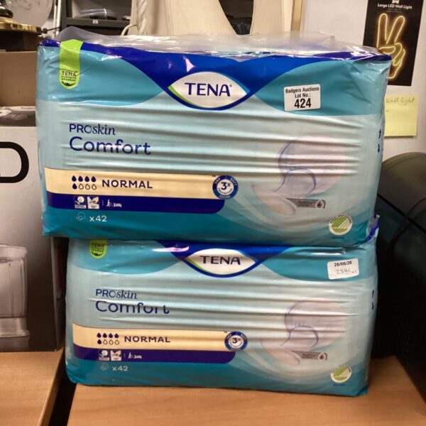 Two packs of Tena Pro Skin comfort pads in original packaging.