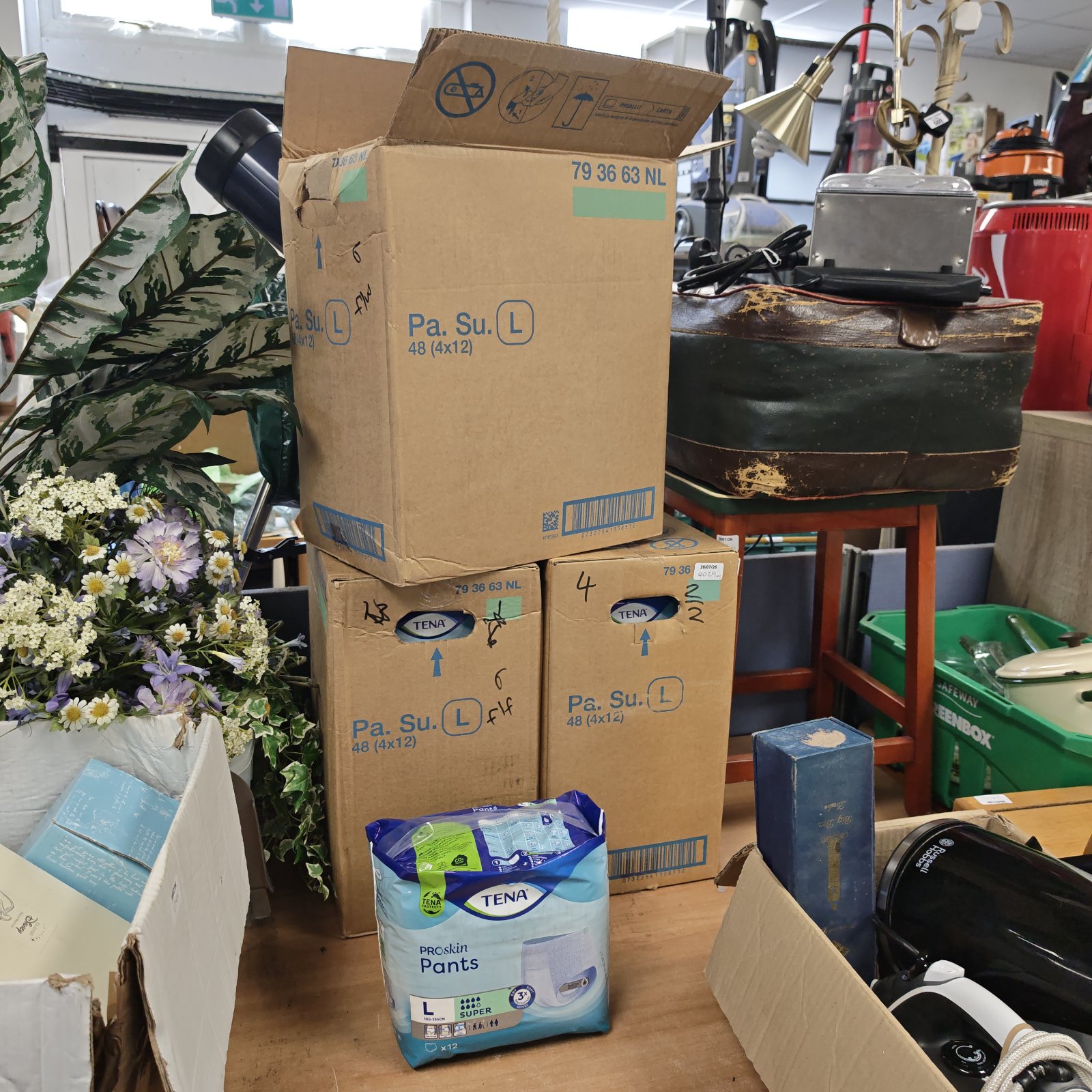 Three boxes of Tena Proskin pants for incontinence protection.