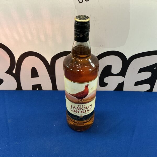 The Famous Grouse blended Scotch whiskey bottle, vintage style.