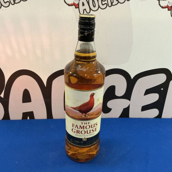 Bottle of The Famous Grouse blended Scotch whiskey for sale.