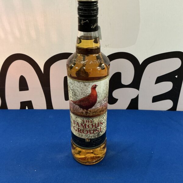 The Famous Grouse Scotch whiskey bottle with label.