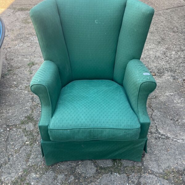 Green Thomasville wingback chair with textured fabric.