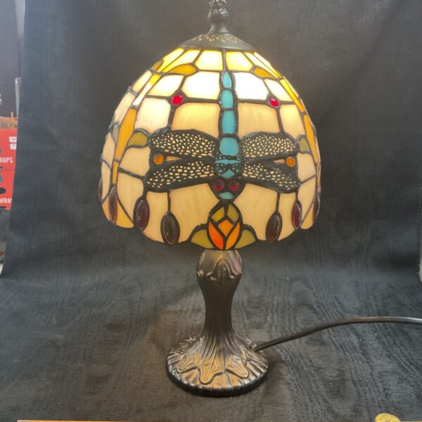 Vintage Tiffany style table lamp with dragonfly design.