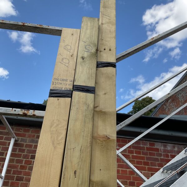 Three bundles of 10ft timber ready for construction projects.