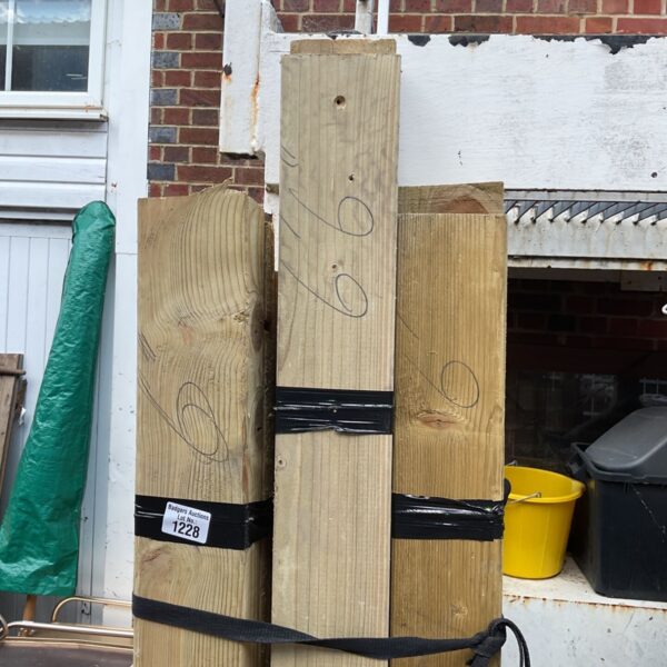 Three bundles of 6ft timber stored outdoors, ready for DIY projects.